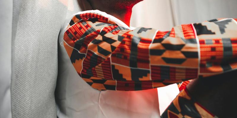 Man holding a difficult balance pose with concentration.